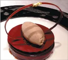  ??  ?? Chocolate ganache with hazelnut ice cream.