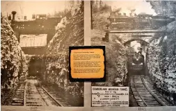  ?? STAFF PHOTO BY BEN BENTON ?? These photos displayed in the Cowan Railroad Museum in Cowan, Tenn., show steam trains crossing paths at the Cumberland Mountain Tunnel in 1885, left, and in 1942, right. The rail line above is the Mountain Goat Railroad, now abandoned and a...