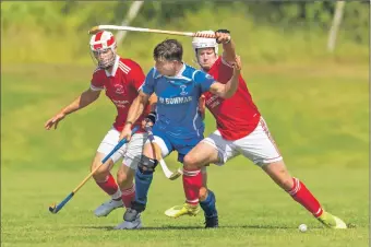  ?? Photograph: Neil Paterson. ?? Kilmallie’s Steven Stewart, centre, comes up against Donald Nixon and John Macrae, both Kinlochshi­el.