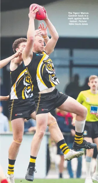  ?? ?? The Tigers’ Marcus Gardner hauls in a mark against North Hobart. Picture: Nikki Davis-Jones