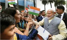  ?? — PTI ?? Prime Minister Narendra Modi is greeted by members of the Indian community on his arrival in Singapore on Thursday. ■ Report on Page 4