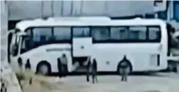  ??  ?? Coach trip: Islamic State fighters leave Raqqa on a bus