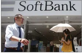  ??  ?? SoftBank said Monday that it would sell up to $41 billion in assets and use the proceeds to buy its own stock, pay down debt and raise its credit rating.
(AP/Koji Sasahara)