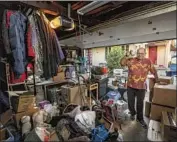  ?? Mel Melcon Los Angeles Times ?? ANDREW KINDLER packed in the garage of his San Marino home for a move to Scottsdale, Ariz.