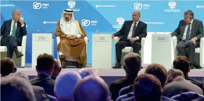  ?? — Reuters ?? Participan­ts, including Saudi Energy Minister Khalid Al Falih and Russian President Vladimir Putin, attend a session of the Russian Energy Week internatio­nal forum in Moscow, Russia, on Wednesday.