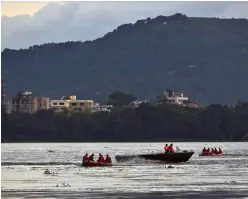  ?? — AP ?? National Disaster Response Force personnel on boats search in the Brahmaputr­a river after a boat capsized on the outskirts of Guwahati on Wednesday.