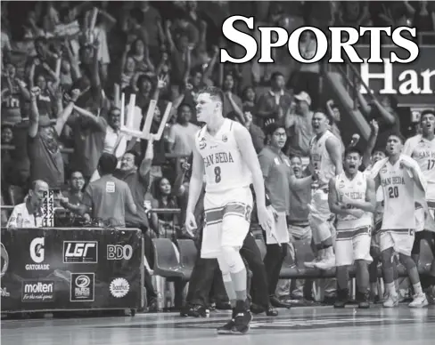  ?? JOSH ALBELDA FOR ABS-CBN SPORTS ?? Robert Bolick gets cheered on by teammates and fans during the 2017 Fil-Oil Flying V Premier Cup finals on Sunday night, June 25 when he scored 3 in the dying seconds to help San Beda Red Lions defeat De La Salle University Green Archers.