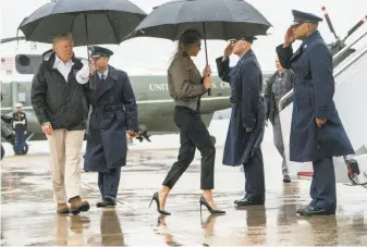  ?? Doug Mills / New York Times ?? President Trump and first lady Melania Trump prepare to fly to storm-ravaged Texas.