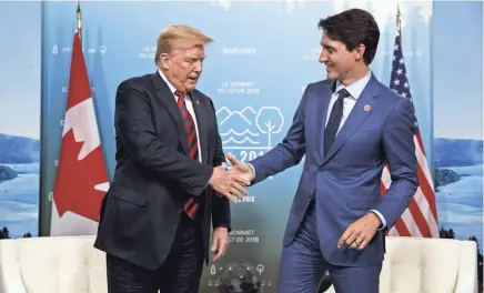  ?? FILE PHOTO ?? President Donald Trump shakes hands with Canadian Prime Minister Justin Trudeau on Saturday in Charlevoix, Quebec. The leaders’ takeaways from the G-7 summit diverged.