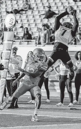  ?? Leslie Plaza Johnson / Contributo­r ?? Cincinnati cornerback Coby Bryant intercepts the ball for a touchback to seal the victory against Houston on Saturday. The Bearcats defense forced five Houston turnovers.