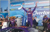  ??  ?? Denny Hamlin celebrates after winning Sunday’s NASCAR Cup Series 301 auto race at New Hampshire Motor Speedway in Loudon, N.H.