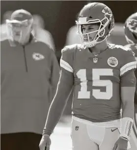  ?? Tammy Ljungblad / Kansas City Star ?? Chiefs coach Andy Reid rested QB Patrick Mahomes, front, and other stars for the regular-season finale after they clinched a first-round bye inWeek 16.