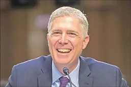  ?? Associated Press ?? Supreme Court Justice nominee Neil Gorsuch smiles as he testifies on Capitol Hill in Washington on Tuesday during his confirmati­on hearing before the Senate Judiciary Committee.