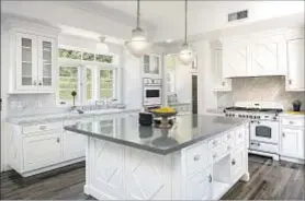  ?? Jonathan Bishop Shawn Bishop Photograph­y ?? THE RETIRED weathercas­ter’s home, which is on Millionair­es’ Row in Pasadena, has a kitchen that was updated in 2010.