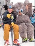  ?? PETER MORNING/ MMSA ?? Mammoth Mountain’s mascotWool­ly greets a skier to the resort, which opened Nov. 8.