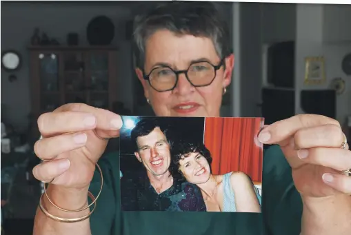  ?? PHOTOS: MARK TAYLOR/WAIKATO TIMES ?? Pinfold holds a photo recalling happy times with husband Dave. Since his move into care, and the lifting of worries at home, she says, ‘‘I can just visit him in love’’.