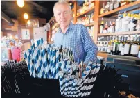  ?? GREG GILBERT/THE SEATTLE TIMES ?? Paper straws sit on the bar at a Dukes restaurant in Seattle. Businesses that sell food or drinks are no longer allowed to offer plastic straws or utensil as of July 1.