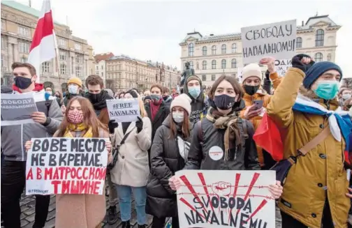  ?? Agence France-presse ?? Russian youth, living in Prague, hold banners during a protest in support of Russian opposition leader Alexei Navalny on Saturday.