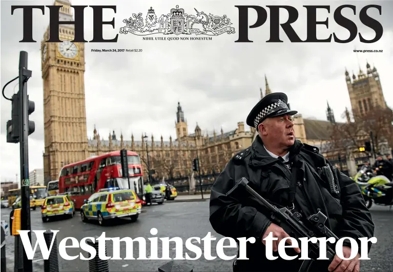  ?? PHOTOS: GETTY IMAGES ?? An armed police officer stands guard near London’s Westminste­r Bridge and the Houses of Parliament after a deadly attack by a single person with suspected terror links. Four people were confirmed dead last night and at least 40 injured as police...