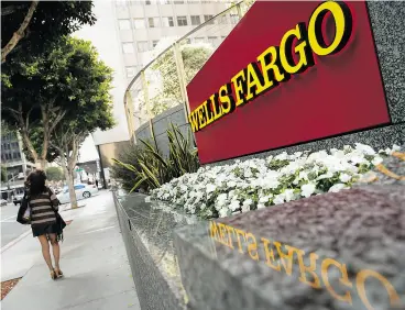  ?? PATRICK T. FALLON / BLOOMBERG NEWS ?? U. S. bank Wells Fargo agreed to take non-financial measures to create a more fair workplace as part of a US$35.5-million settlement with its black financial advisers.