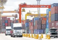  ?? APICHART JINAKUL ?? Shipment containers for export are seen at Laem Chabang port in Chon Buri province.