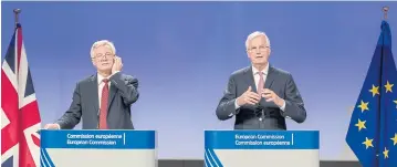  ?? AP ?? EU chief Brexit negotiator Michel Barnier, right, and British Secretary of State David Davis address the media on Thursday after a week of negotiatio­ns at EU headquarte­rs in Brussels.