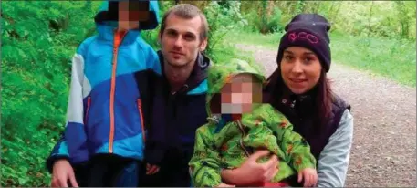  ??  ?? Rafal Karacyzn centre with his late wife Natalia and two of their three children.