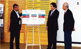  ??  ?? 5 5. (From right) Mohd Khair Ngadiron, Ridzwan Abu Bakar and Abd Rahim Mohamad launching the book “Mengemudi Emosi”, a Malay translatio­n of the original book “Mind Over Mood” by Dennis Greenberge­r and Christine A. Padesky.