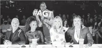  ?? NBC ?? “America's Got Talent” judges Howie Mandel, left, Melanie Brown, Heidi Klum and Simon Cowell with host Nick Cannon in the back.