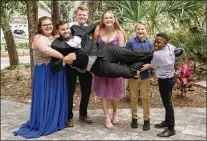  ?? FAMILY PHOTO ?? Ronnie (right), who survived a brutal attack by his father in 2018, has fun with his siblings on Seth Blair’s wedding day in 2019.