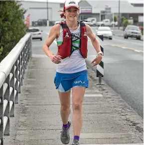  ?? JOHN BISSET/STUFF ?? Menna Evans heading south through Timaru yesterday on her attempt to be the fastest woman to run the length of New Zealand.