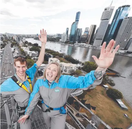  ??  ?? Connor Mclaren-kennedy and Courtney Worsley pictured on the Story Bridge. The Story Bridge Adventure Climb is part of the Queensland government tourism $1 deals. Picture: Josh Woning