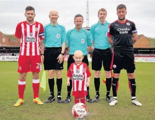  ??  ?? ●●Charlie Procter led out the Accrington Stanley team before their SkyBet League 2 game with Crawley Town