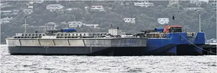  ?? PHOTO: GREGOR RICHARDSON ?? Barges at large . . . Port Otago’s new $1.5 million barge TR Healy (left) alongside the $1.4 million barge Hapuka in Dunedin’s upper harbour Steamer Basin yesterday.