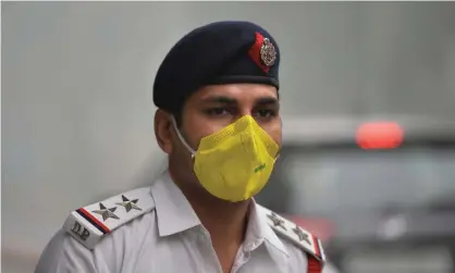  ??  ?? A traffic policeman in Delhi. Politician­s are blaming each other for the crisis. Photograph: Sajjad Hussain/AFP via Getty Images