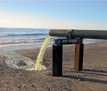  ??  ?? Upgrades to infrastruc­ture will mean no more scenes like this outlet pipe from Hokitika’s oxidation ponds flowing directly onto the beach.