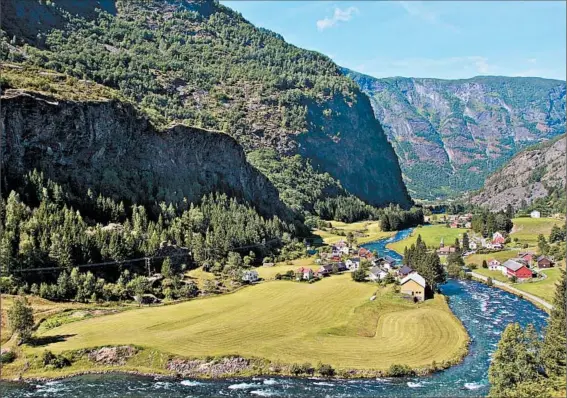  ?? LISA LUBIN/FOR TRIBUNE NEWSPAPERS ?? A view of the old village of Flam from the Flamsbana, or Flam Railway, one of the world’s steepest railways, which makes its way up the mountains to 3,000 feet above sea level.