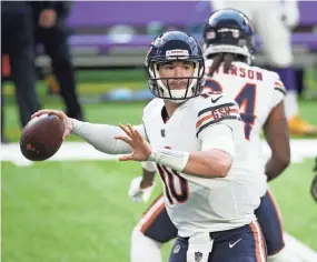  ?? BRUCE KLUCKHOHN/AP ?? Bears quarterbac­k Mitchell Trubisky throws a pass against the Vikings on Sunday in Minneapoli­s. Chicago won 33-27.