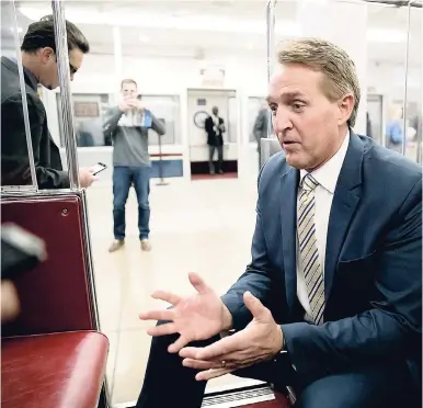  ?? AP ?? Senator Jeff Flake, R-Arizona, talks to reporters just after a blistering speech on the Senate floor aimed at President Donald Trump at the Capitol in Washington, yesterday.