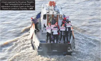  ?? — AFP ?? A boat organised by the group ‘People’s Vote’ campaignin­g for a second referendum on Brexit is seen on the River Thames in London on Thursday.