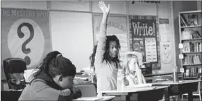  ??  ?? A student raises her hand in class. (Photo: quietrevol­ution)