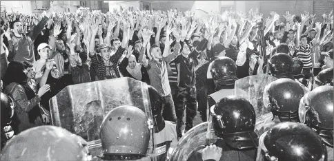  ??  ?? Protesters stand off before police during a demonstrat­ion against corruption, repression and unemployme­nt in Al Hoseima, Morocco. — AFP photo