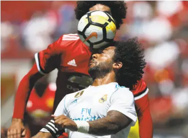  ?? Beck Diefenbach / AFP / Getty Images ?? Real Madrid defender Marcelo da Silva Junior heads the ball during the lightly contested friendly at Levi’s. “Far more important than the results is the work,” Manchester manager Jose Mourinho said.