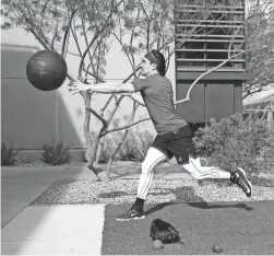  ?? ROB SCHUMACHER/THE REPUBLIC ?? Diamondbac­ks outfielder Corbin Carroll throws a medicine ball during a spring training workout at Salt River Fields on Friday.