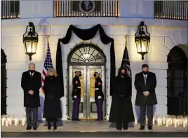  ?? Evan Vucci The Associated Press ?? From left, President Joe Biden, First Lady Jill Biden, Vice President Kamala Harris and her husband, Doug Emhoff, bow their heads Monday at a White House ceremony honoring the 500,000 Americans who have died from COVID-19.