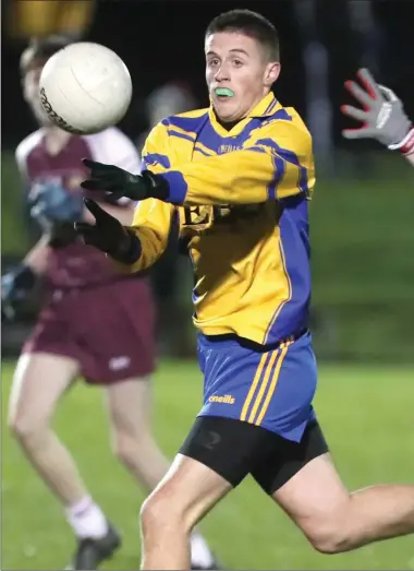  ??  ?? Dylan McCready of St Mary’s DS starts an attack for his team as Bush PP captain Gerard White closes in during last Thursday’s Lennon Cup Final in Darver.