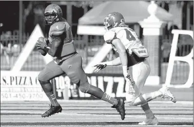  ?? Photo courtesy of Central Arkansas ?? Central Arkansas senior quarterbac­k Wynrick Smothers eludes Nebraska-Kearney defender Trey Andersen in the first half of Saturday’s game in Conway. Smothers, last year’s Southland Conference offensive player of the year, suffered a broken ankle in the...