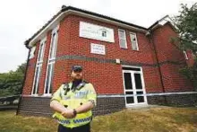  ?? Reuters ?? A police officer stands in front of Amesbury Baptist Church, which has been cordoned off after two people were hospitalis­ed and police declared a major incident .