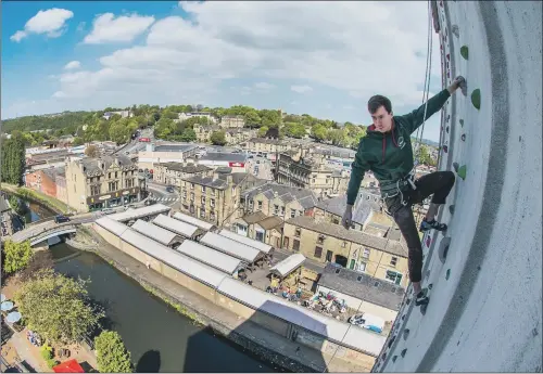  ?? PICTURE: JAMES HARDISTY. ?? TOWERING FEAT: GB team climber Luke Murphy on one of the climbing routes on the ROKTFACE wall, which is opening in Brighouse.