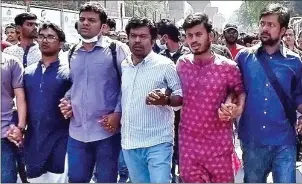  ?? AFP ?? Activists march and shout slogans during a demonstrat­ion in Dhaka on Saturday following the death of writer Mushtaq Ahmed in jail months after his arrest under internet laws which critics say are used to muzzle dissent.
